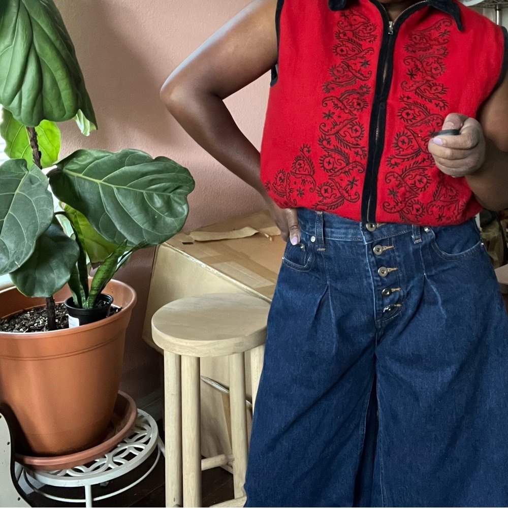 Red Embroidered Vest with Blue High-Waisted Jeans